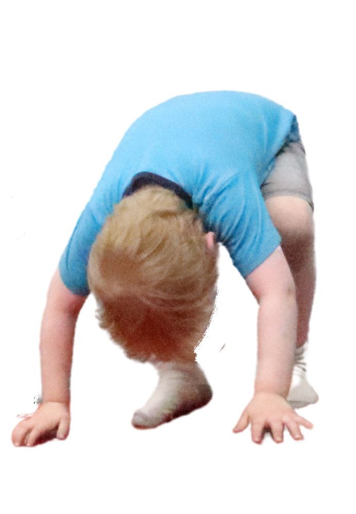 Preschool child doing a somersault or roll